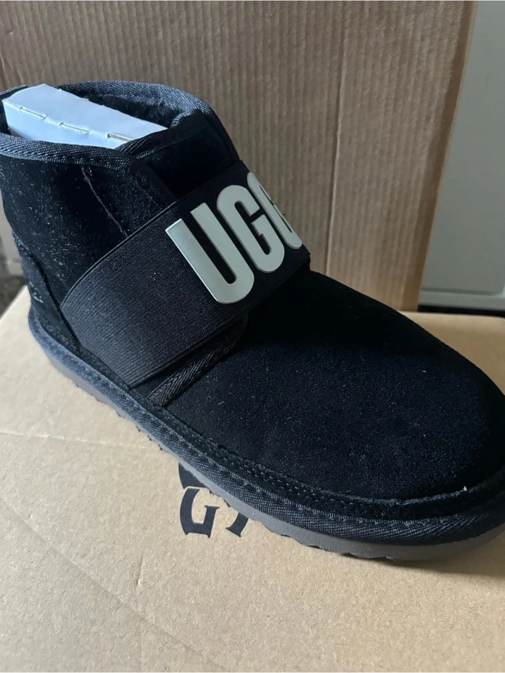 UGG Kids Black Suede Slip-On Boot with Logo Strap